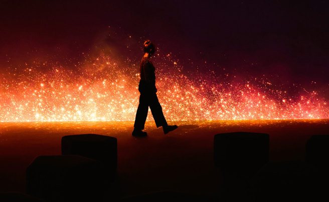 Scenes of fire and flame in The GIANTS immersive in the learning Lab, Melbourne Museum