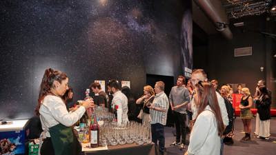 People lining for drinks outside the planetarium at Scienceworks.
