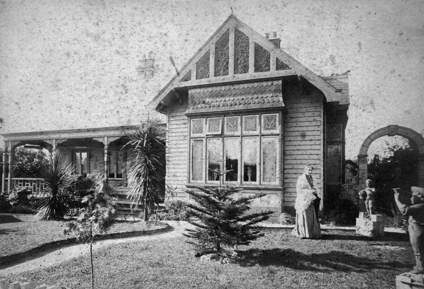 Lizzie Twycross standing outside the fron of Emmarine II, circa 1905.