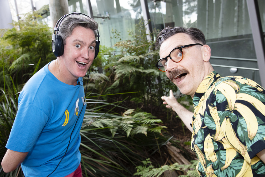 The Listies, comic duo Richard Higgins and Matt Kelly in Forest Gallery promoting their Melbourne Museum Audio Guide App. Matt is wearing headphones.