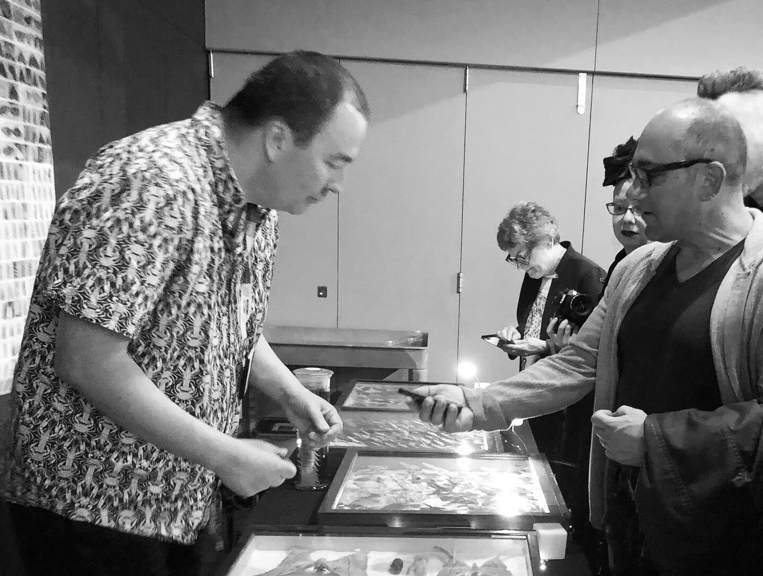 L-R Simon Hinkley with Richard Morden, Ruth Straker and her camera, and Prof Coleman examining specimens at Nocturnal, Melbourne Museum, 4 October 2019