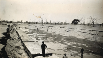 Filled railway trucks at the 65 mile ballast pit, Moama to Balranald line, circa 1923-26