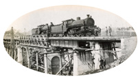 Two 117t A2 class steam locomotives stopped on the bridge over the Nicholson River on the Bairnsdale to Orbost line, 1915