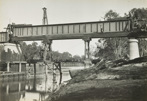 Construction of the rail bridge over the Murray River, Yarrawonga, circa 1930. A 100 foot girder is being moved into place on the piers.
