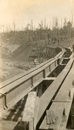 Rail bridge construction, Bairnsdale to Orbost line, circa 1914-15. Girders have been laid on the piers but are still to be fixed in place.