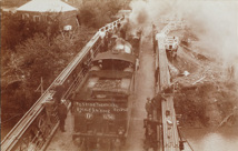Testing the rail bridge over the Murray River on the Strathmerton to Tocumwal line, Tocumwal, July 1906. A DD class steam locomotive is passing over the bridge at 8 miles per hour.