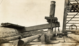 Bridge over the Nicholson River, Bairnsdale to Orbost line. A test pile loaded with a counter-levered dead weight of rails has been driven to a depth of 60 ft, circa 1912.