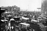 The crowded intersection outside Flinders Street and Princes Bridge Stations, Melbourne, circa 1925