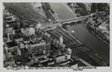 Aerial view of Flinders Street Station with the Yarra River, Princes Bridge and many commercial buildings, post-1930