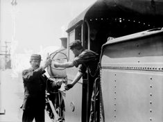 Station and train staff exchanging electric