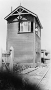 Signalman sitting in signal box window, Mentone Railway Station, pre-1930