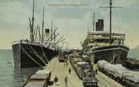 Goods train at Port Melbourne Pier, circa 1911. Liners are moored on either side of the pier.
