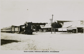 Train passing through Broadway, the main street of Wycheproof, circa 1930