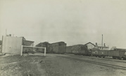 Passenger and goods carriages at an unidentified railway station or siding, post-1910
