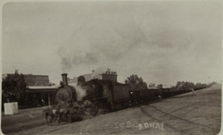 Steam locomotive passing the Wycheproof Hotel, circa 1930