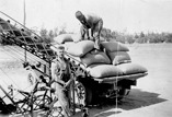 Men loading a grain elevator, Bambill, circa 1930