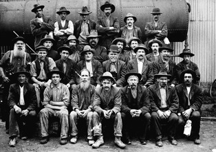 Bendigo workshop staff posed in front of a steam boiler, 1911