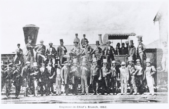 Group of 35 engineers and clerical staff from the Engineer-in-Chief's Branch of the Victorian Railways Department posing in front of one of the government railway's early Beyer Peacock 0-2-0 passenger locomotives, circa 1862