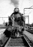 Driver and fireman standing on A2 class steam locomotive no. 915, Spencer Street Station
