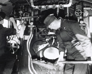 Loco crew driving and firing a Victorian Railways locomotive at North Melbourne Loco Depot, circa 1950