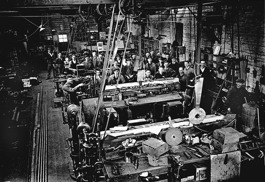 Workers on the factory floor in a railway workshop, Melbourne, 1927