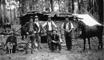 Railway workers in front of a slab hut, Bairnsdale to Orbost line, Simpson's Creek, 1914