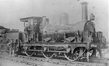 Locomotive crew with steam locomotive, circa 1885
