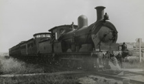 Driver leaning out of the doorway of Y class steam locomotive no. 397, Glen Iris, circa 1922