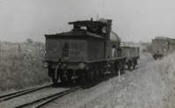 A class steam locomotive no. 122 hauling a goods truck, Darling, circa 1922