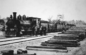 Locomotive with rail trucks carrying groups of men, Bruthen district, circa 1915