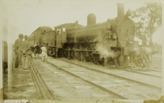 Steam locomotive no. D2 766 with passenger carriages attached, circa 1920