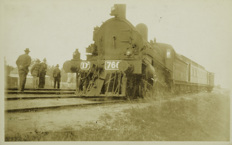 Steam locomotive no. D2 766 with passenger carriages attached, circa 1920