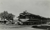 Two carriage diesel train with Victorian Railways logo on its front, Wycheproof, post-1935