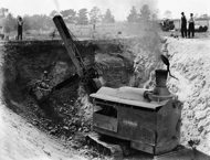 Excavation on track with steam shovel