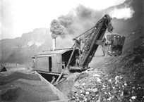 Steam shovel and rail trucks