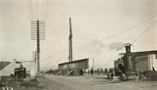 Construction of the Dynon Road rail bridge on the South Kensington to West Footscray line, Kensington, 1928. A crane is about to lift the first 112 ft girder into position.