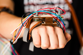 Detail of A.T.O.M. Humanoid Robot's Cables and Hand Brace connected to Human Hand