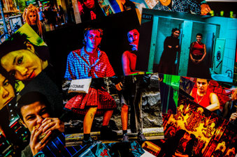 An image of many colourful photographs laid randomly ontop of one another to create a collage effect. 