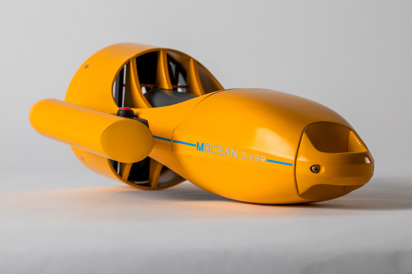 A side view of a metal yellow hand-held propulsion device, with a red button, laying on its side. Handles are apparent from the top and side 