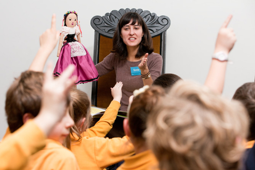 A museum staff member running an education program