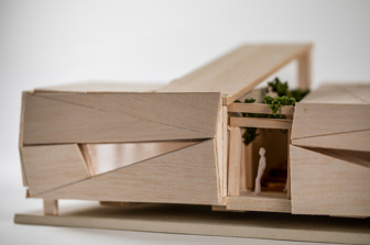 Close up of the corner of a minitaure balsawood model of a portable classroom