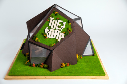 Wide shot of an architectural model of a honeycomb style gymnasium structure