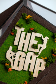 Close up of logo on the side of a miniature model gymnasium 