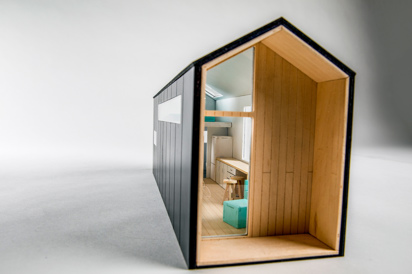 Three-quarter interior view of an architectural model of a compact, modern house