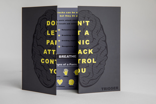 Promotional leaflet is half open, showing the word 'breathe' inside. The front cover when closed shows a drawing of a set of lungs and reads 'Don't let a panic attack control you'