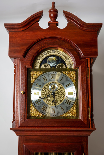 Close up of metal engravings on clock face