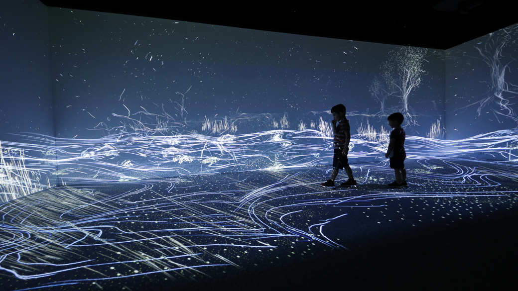 Wall and floor projections in the Learning Lab showcase.