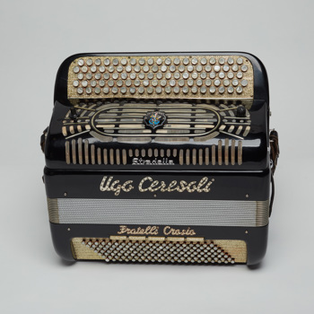Button accordion belonging to Ugo Ceresoli, post-1950. The accordion was manufactured by Fratelli Crosio, Stradella, Lombardy, Italy.