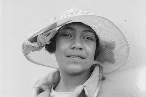 Head shot of a woman wearing a hat