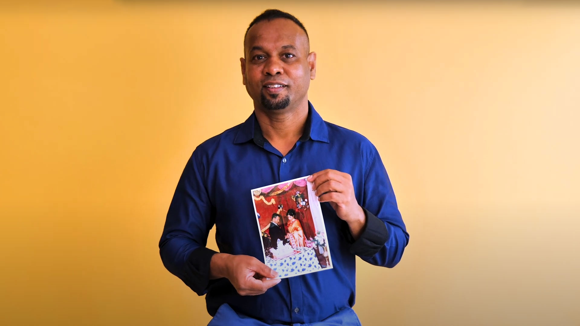 Man holding a photograph